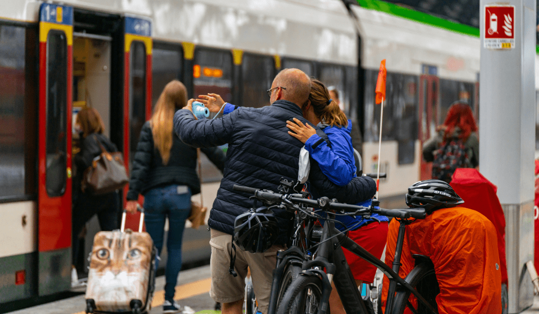 group of people waiting to board train