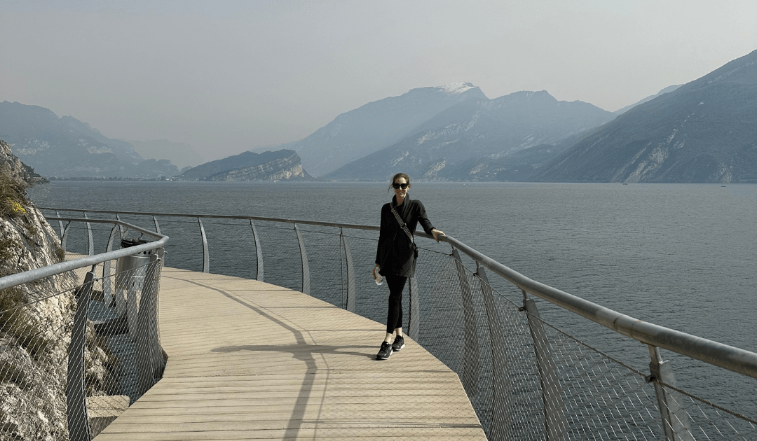 Woman walking on a bridge in Lake Garda