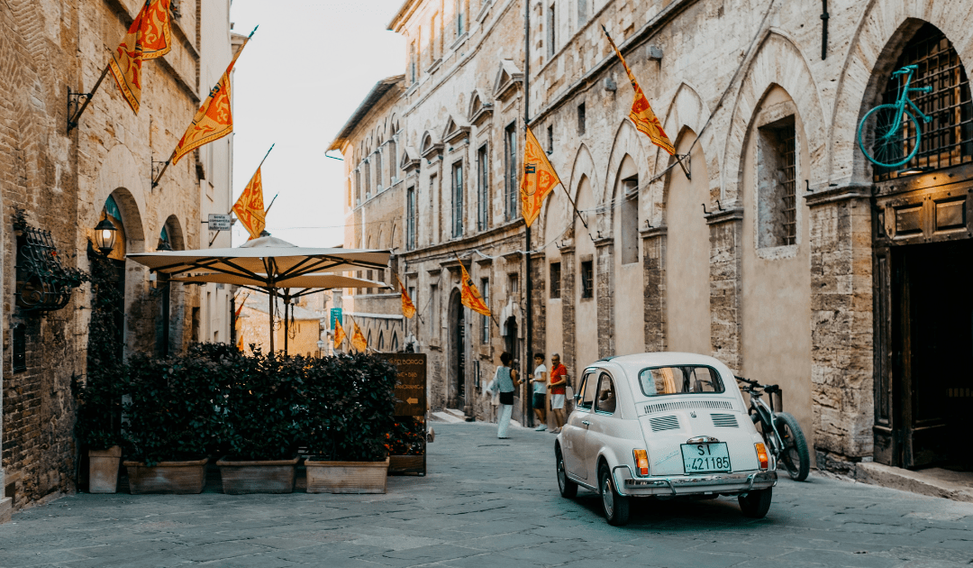 Fiat 500 Driving through a town in Umbria