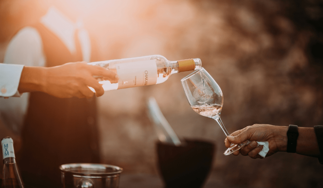 Red wine being poured into glasses | The Italian On Tour