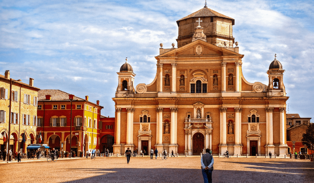 Man standing outside a church in Modena on a sunny day | The Italian On Tour