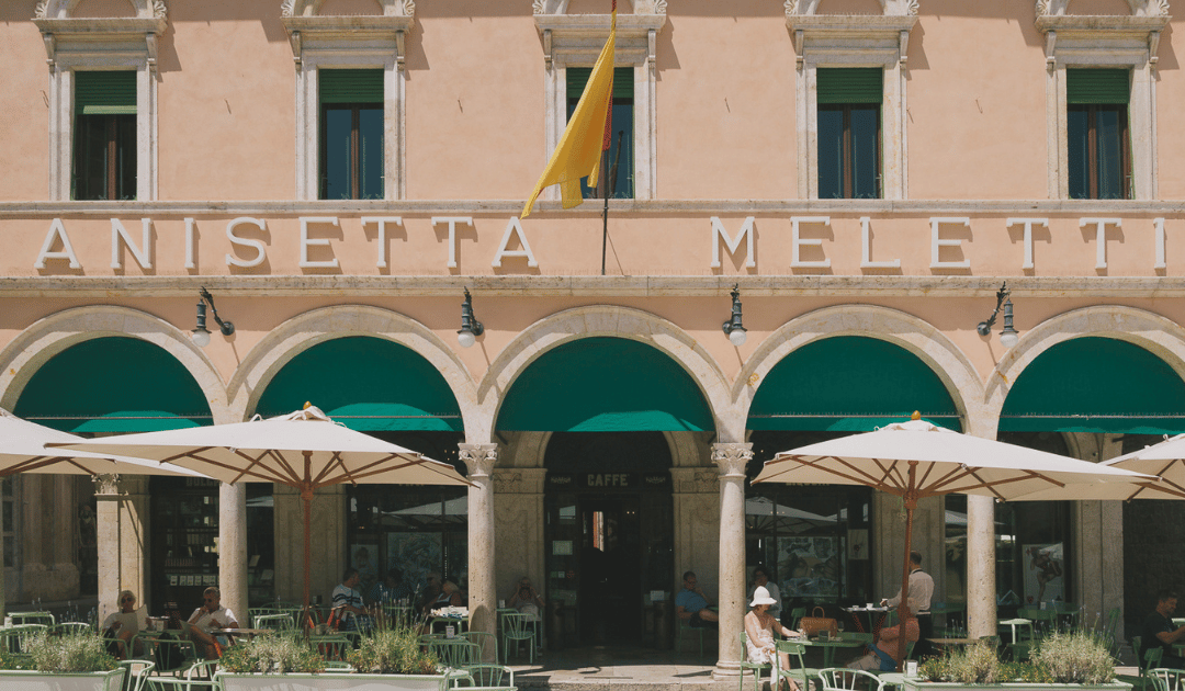 people sitting outside in Caffe Meletti in the town of ascoli piceno