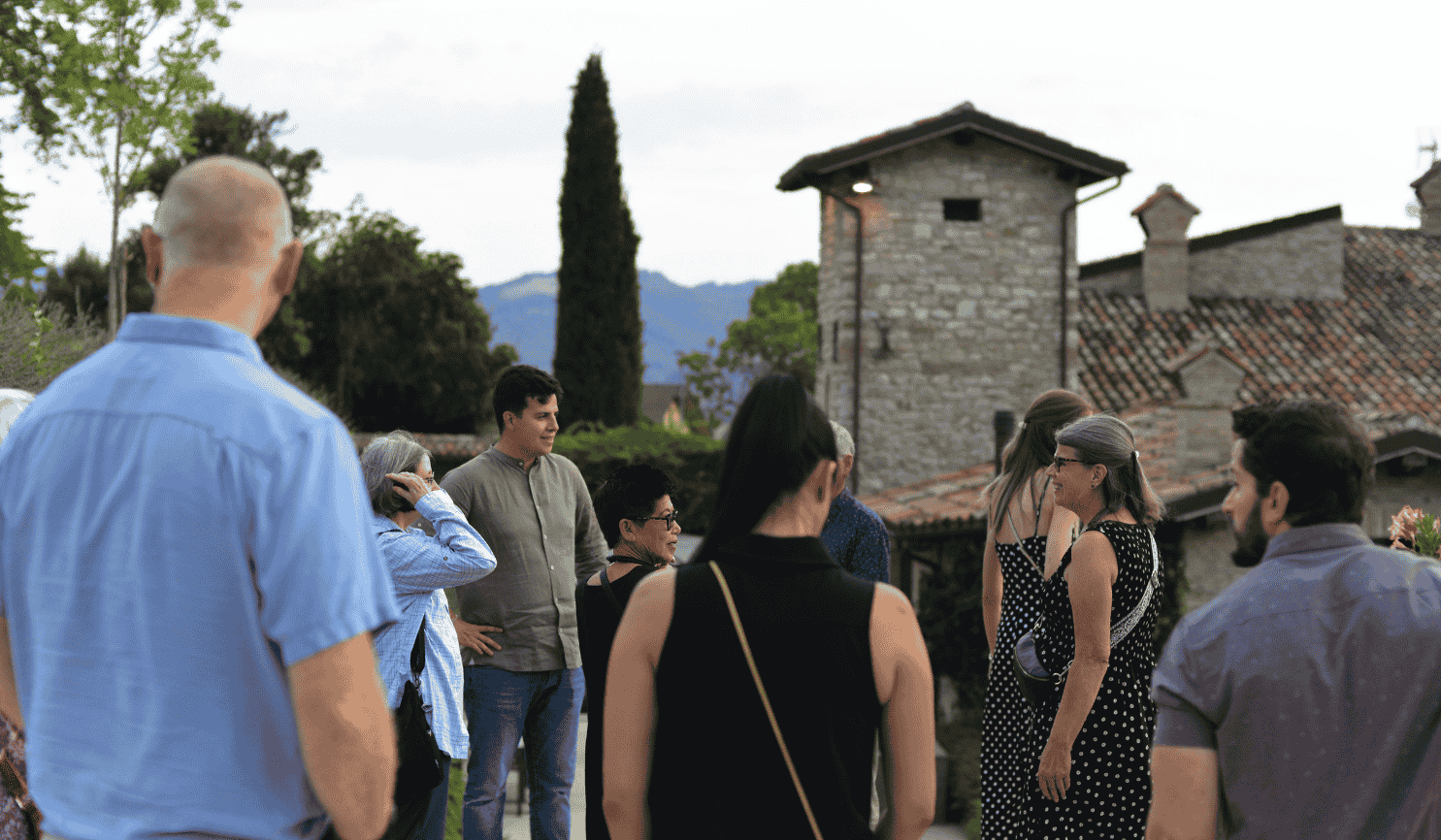 group of travellers in umbria outside in september at a local winery